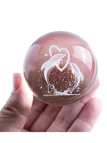 Enhance your home decor with the Dolphin Magic Crystal Ball Night Light. The elegant design features a crystal ball with a swimming dolphin inside, adding a touch of underwater charm to any room. With its soft and calming light, this night light creates a peaceful atmosphere for relaxation.