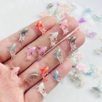 Add a touch of cuteness to your crafts and jewelry with our Adorable Mini Shiny Goldfish Resin Figurines! With 100 pieces per pack, you'll have plenty to work with. Made from high-quality resin, these figurines are perfect for adding a unique and eye-catching element to your creative projects.