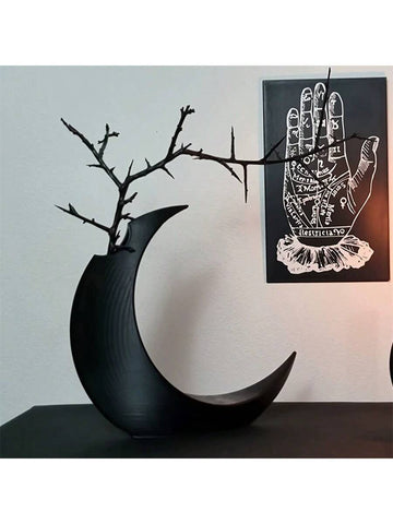 This Gothic 3D Printed Moon-Shaped Flower Vase is the perfect addition to your Halloween and year-round home decor. Crafted with intricate details and a unique shape, this vase adds a touch of elegance and spookiness to any room. Made with high-quality materials, it's durable and long-lasting.