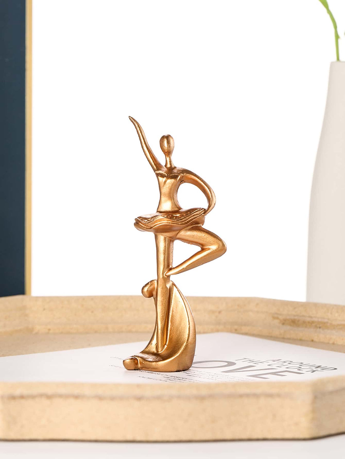 This elegant Ballet Dancer Decorative Object is the perfect addition to your home decor. Crafted with grace and attention to detail, it adds a touch of sophistication to any room. Made from high-quality materials, it is not only aesthetically pleasing but also durable. A must-have for any ballet lover or interior design enthusiast.