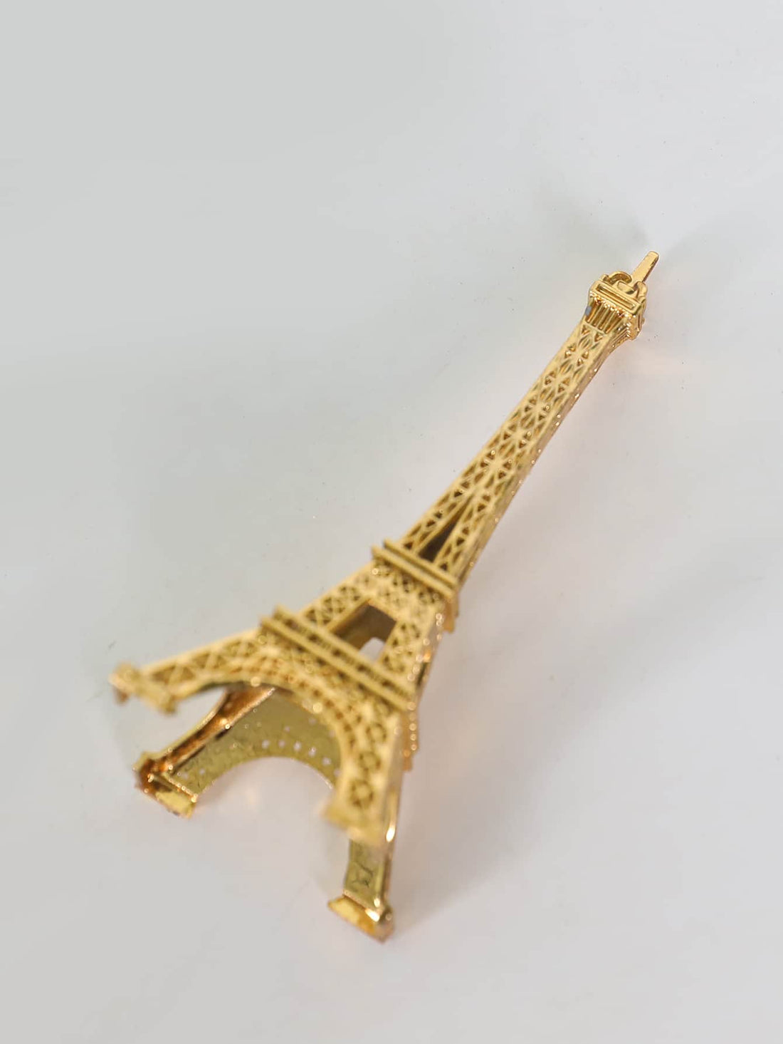 Expertly crafted, this Metal Eiffel Tower Decoration adds a touch of sophistication to any home or office space. Made of high-quality metal, it is a stylish accent that showcases your refined taste. Perfect as a gift or for personal use, it elevates any room with its elegant and timeless design.