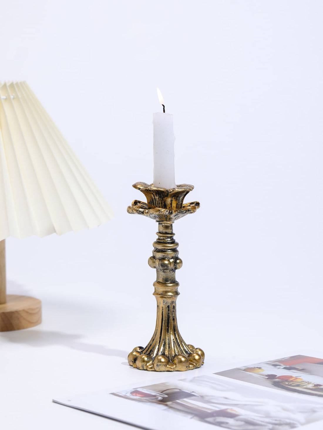 This elegant vintage-inspired candle holder adds a timeless touch to any home décor. Crafted with intricate details and exquisite craftsmanship, it brings a touch of sophistication to any room. The perfect accent piece for creating a warm and inviting atmosphere, it is a must-have for any candle lover.