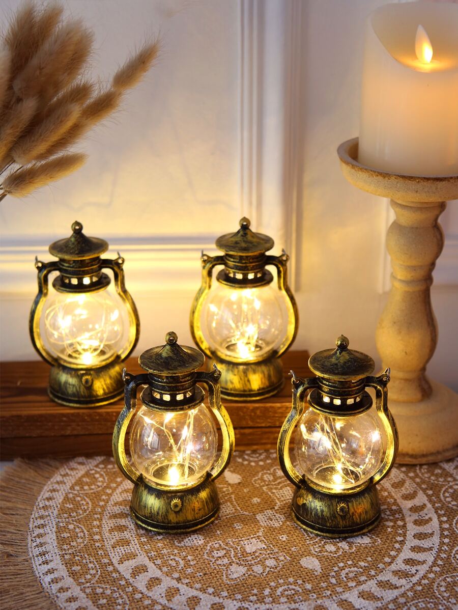 Vintage LED kerosene lantern with warm fairy lights and aged bronze finish.