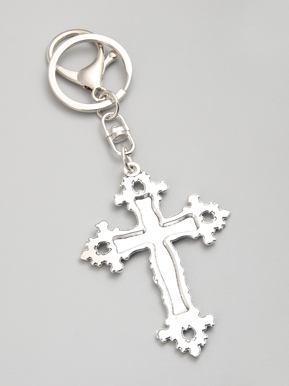 Elevate your accessories game with our glamorous floral cross keychain. Made from high-quality materials, this keychain adds a touch of elegance to any outfit. With its intricate design and durable construction, it's the perfect way to keep your keys organized while making a stylish statement.