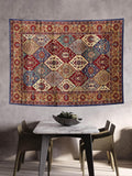 Red navy teal beige and cream floral patchwork wall hanging above bench