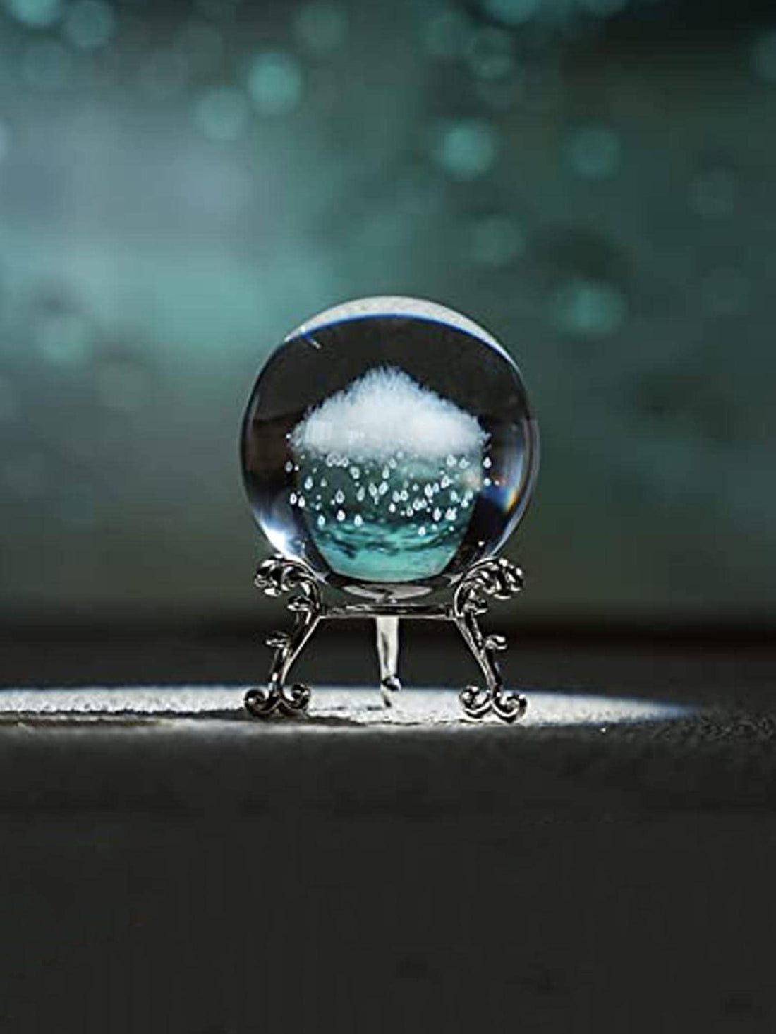 Expertly crafted with modern glass, this Crystal Ball Cloud Design adds a touch of elegance to any home. Its unique design offers a mesmerizing display, perfect for any decor style. Transform your living space with this stunning decoration.