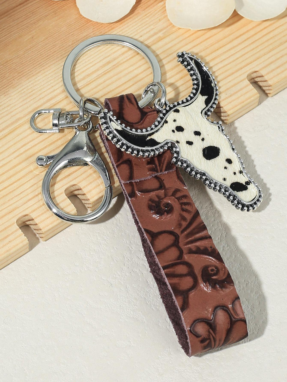 Add a touch of casual elegance to your look with our Vintage Floral Embossed Cowhide Leather Cross Turquoise Keychain. Crafted with precision, this charming accessory is made from durable cowhide leather and adorned with a beautiful floral embossed design. Perfect for adding a pop of color and style to your keys or purse.