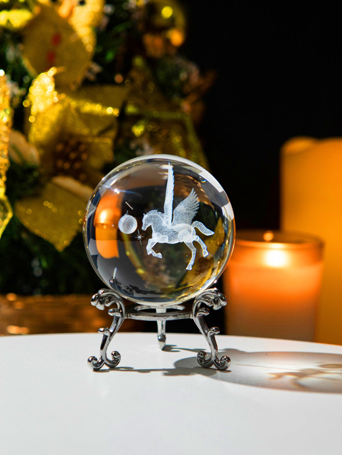 This stunning table decor, the Magical Pegasus 3D Crystal Ball, adds a touch of enchantment to any space. Crafted from high-quality crystal, this detailed 3D sculpture captures the beauty and grace of the mythical Pegasus. A perfect addition to your home or office, this crystal ball is sure to inspire and captivate.