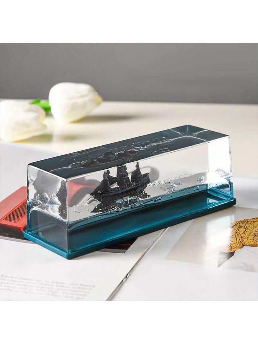 Add a touch of adventure and intrigue to your desk with our Black Pearl Pirate Ship Drift Bottle Desk Ornament. Crafted with attention to detail, this unique piece showcases a miniature pirate ship inside a glass drift bottle. Perfect for any pirate enthusiast or nautical lover, it's a great addition to any workspace.