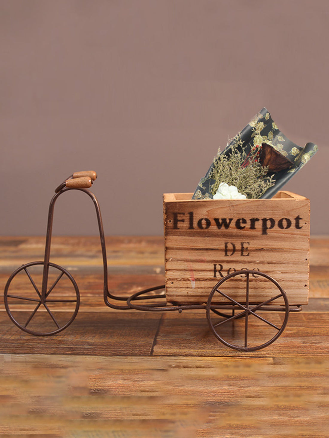 This charming wooden bicycle flower pot stand is the perfect decorative addition to any home or garden. Crafted with excellent craftsmanship, it adds a touch of whimsy and style to your space. Its sturdy design allows for multiple pots to be displayed, making it both functional and beautiful.