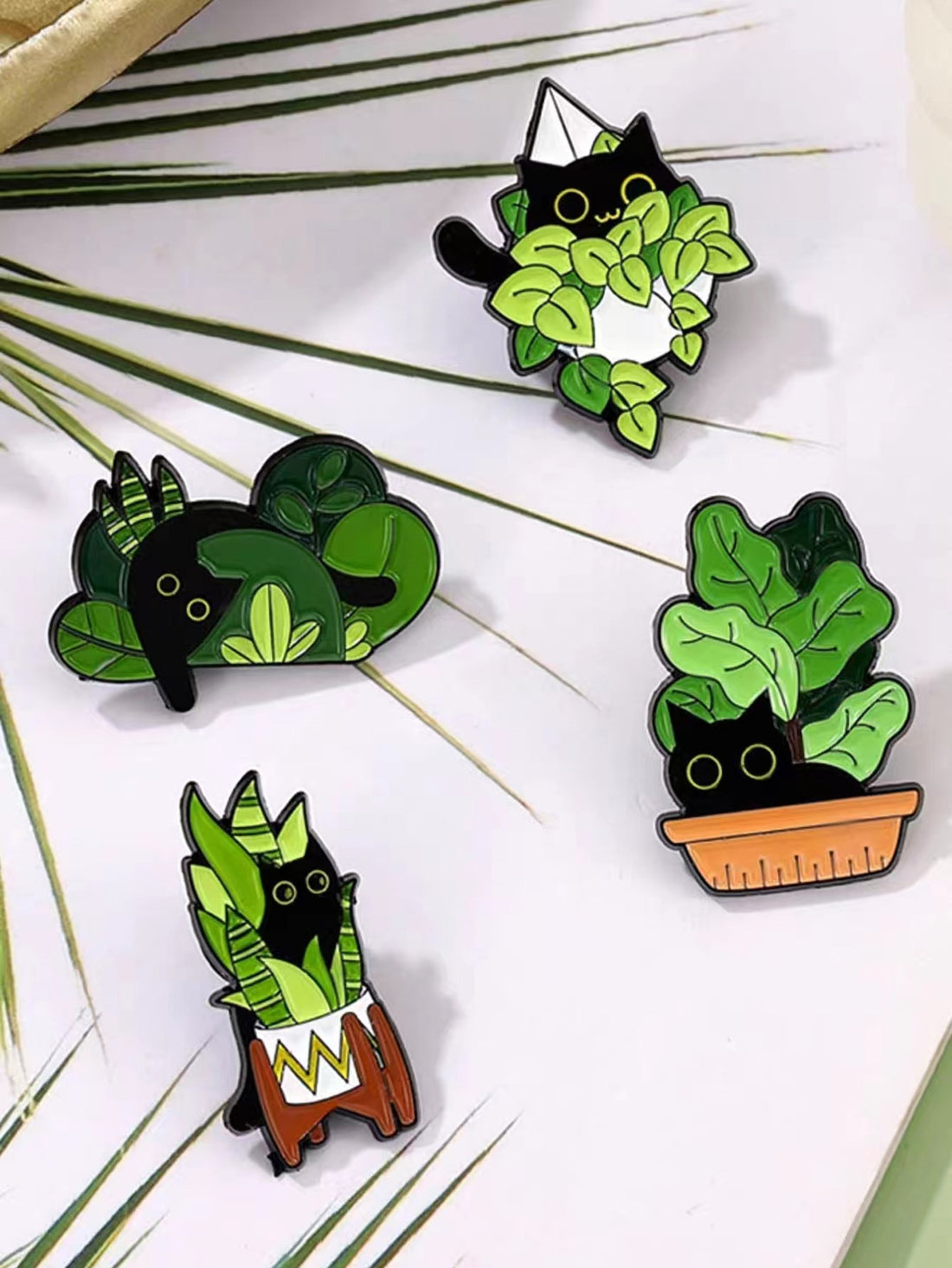 Enhance your daily style with this adorable set of 5 enamel pins featuring cute potted cat designs. Made specifically for women, these pins are a charming addition to any outfit. Made with high-quality materials, these pins are durable and guaranteed to bring a smile to your face every time you wear them.