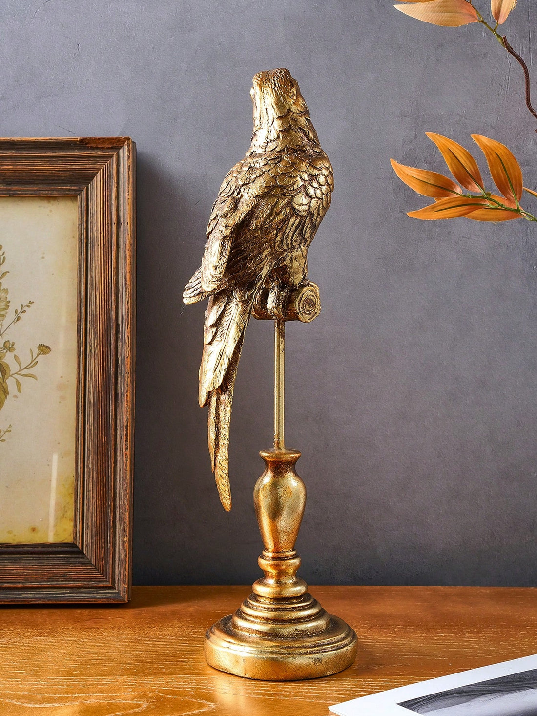 Add a touch of jungle chic to your space with this vintage-style parrot decorative ornament. Crafted with attention to detail, it offers a unique addition to your home decor. Perfect for animal lovers, its vibrant colors and intricate design bring a lively and playful atmosphere to any room.