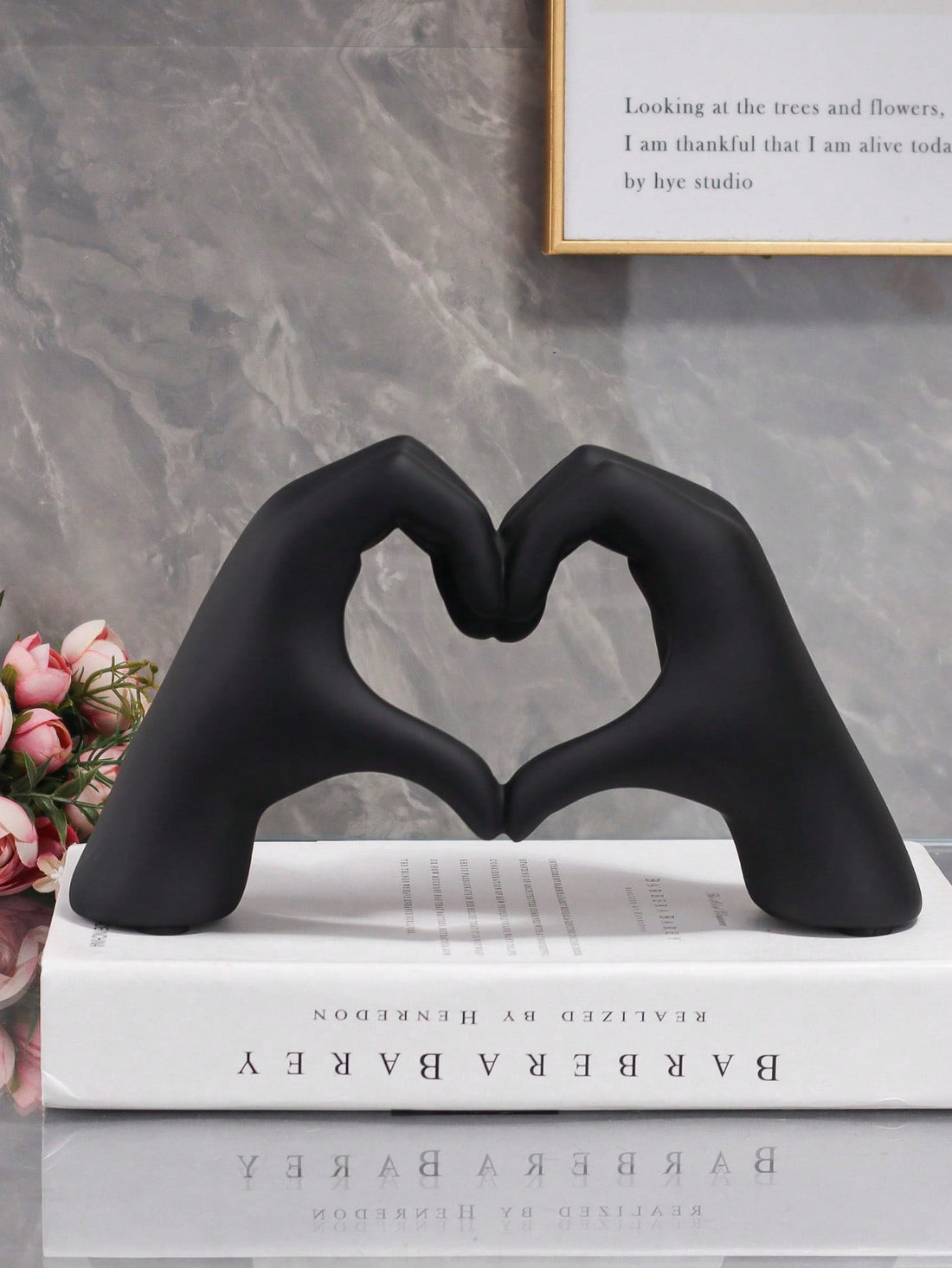 Indulge in elegant home decor with the Black Heart Hand Shaped Ornament. Made for chic taste, this ornament showcases a black heart hand crafted with care. Enhance your home's aesthetic with this stunning and unique addition.