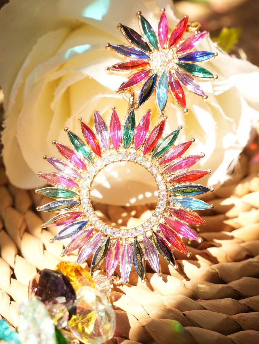 Close-up of colorful floral crystal suncatcher with rainbow petal rings and faceted crystal beads