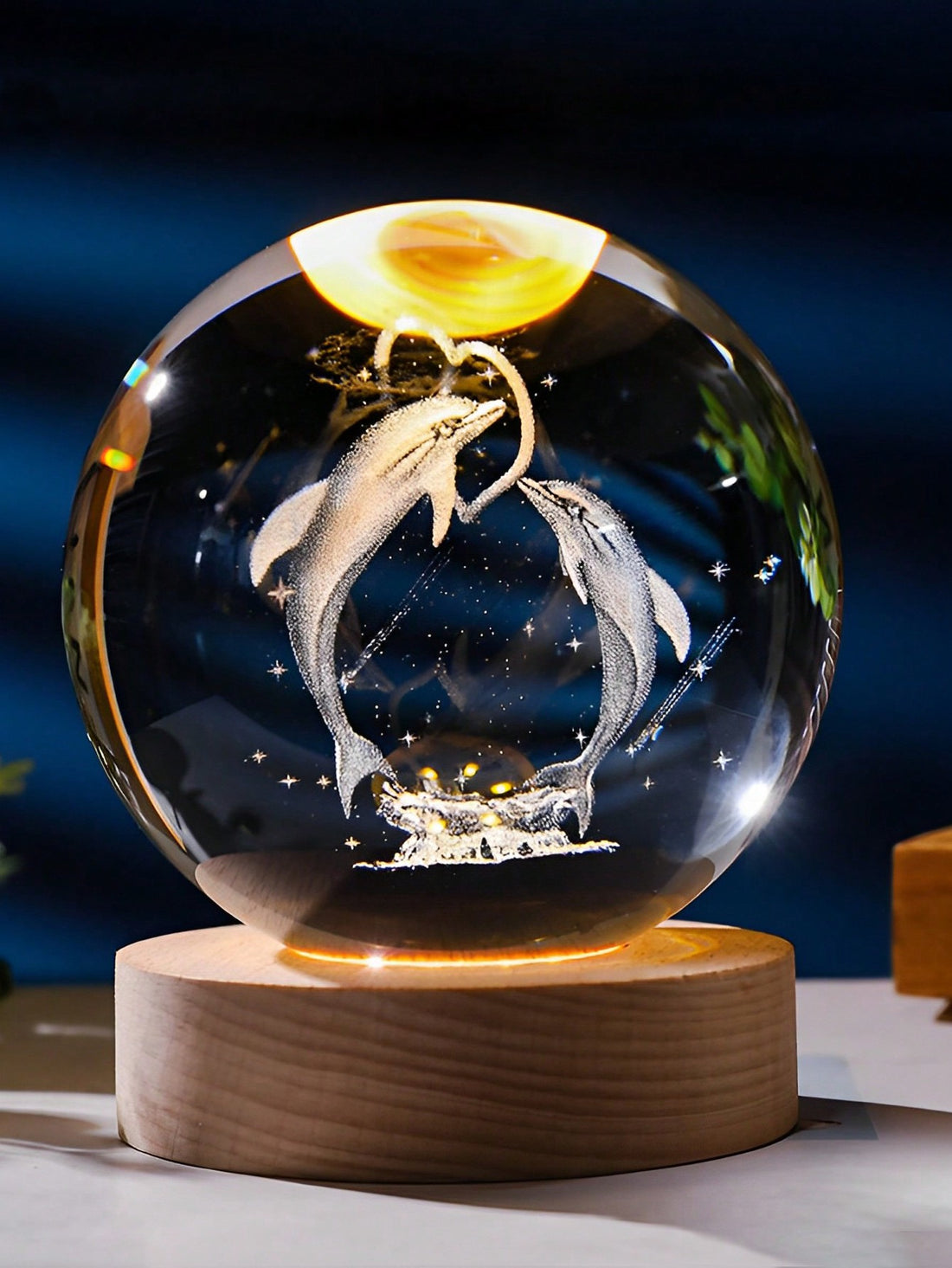 Enhance your home decor with the Dolphin Magic Crystal Ball Night Light. The elegant design features a crystal ball with a swimming dolphin inside, adding a touch of underwater charm to any room. With its soft and calming light, this night light creates a peaceful atmosphere for relaxation.