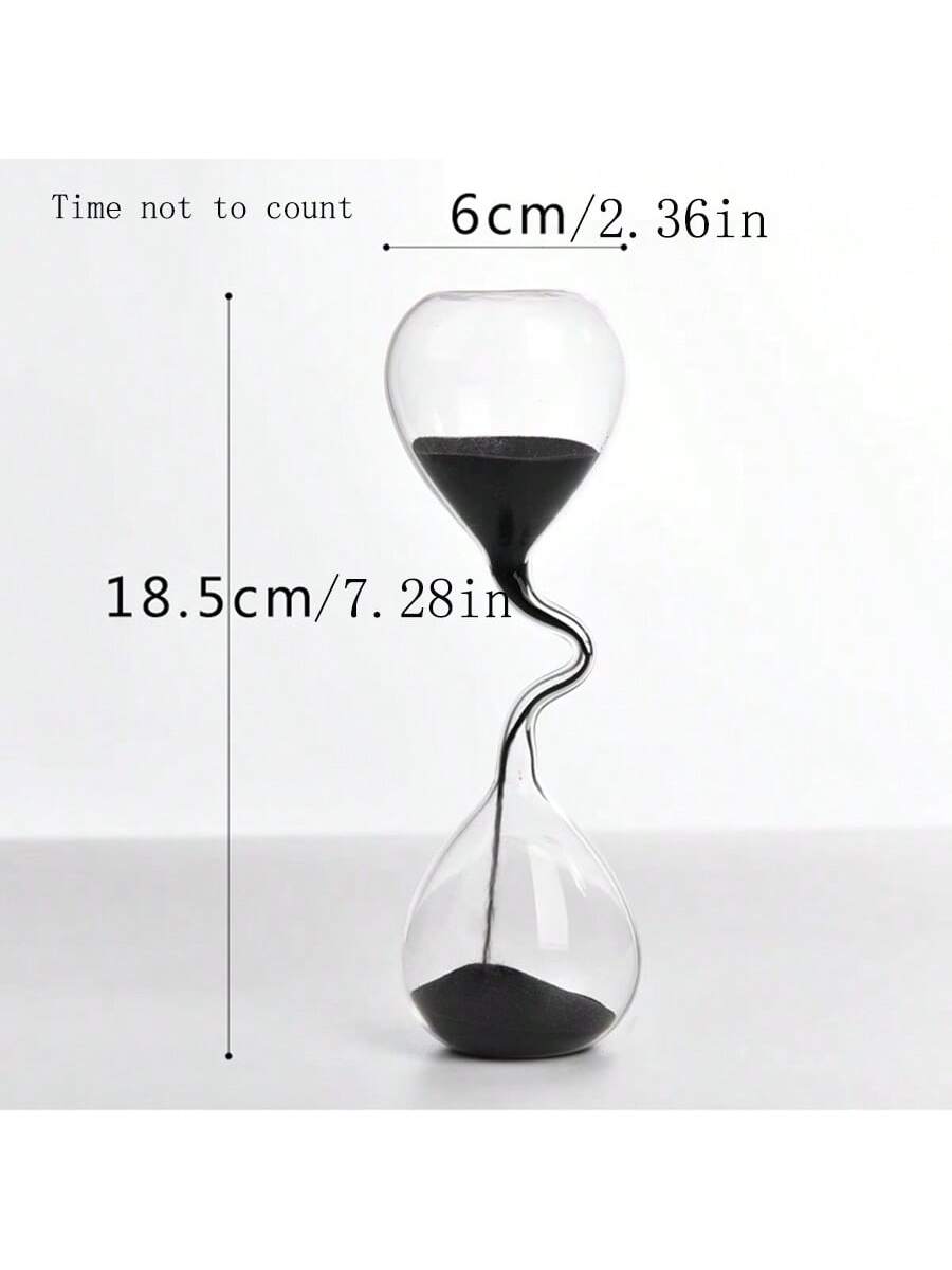 Upgrade your home or office decor with our sleek and stylish black glass sand timer. The modern design not only adds a touch of elegance, but also serves as a functional desktop accessory. Keep track of time in a sophisticated way with this unique piece.