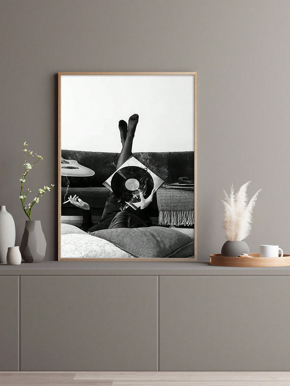 Elevate your space with this striking minimalist record art print, designed for discerning music enthusiasts. Rendered in sophisticated black and white, the clean geometric composition celebrates vinyl culture while maintaining timeless aesthetic appeal. The understated design complements modern, eclectic, and contemporary interiors seamlessly. Perfect for music rooms, studios, or living spaces seeking refined visual interest without overwhelming décor. This print captures the essence of analog passion thro