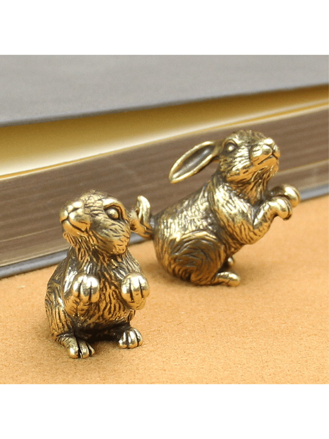 This adorable brass bunny ornament adds a whimsical touch to your home decor. Made from high-quality brass, it is a durable and charming addition to any room. Its intricate design and expert craftsmanship make it a unique and delightful accent piece. Create a playful atmosphere with this charming bunny ornament.