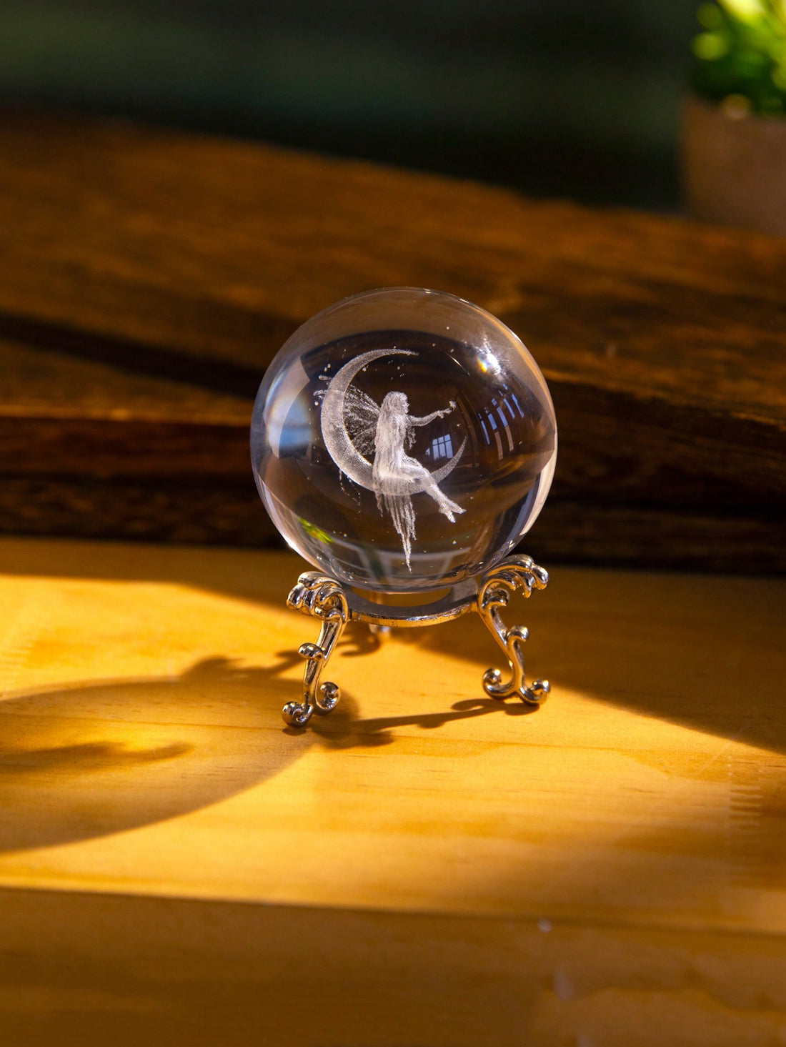 Illuminate your home with the Enchanted Moon Fairy Crystal Ball. This exquisitely detailed 3D laser engraved statue adds a touch of magic to any room. Perfect for home décor or party decoration, this crystal ball is sure to captivate with its intricate design and enchanting beauty.