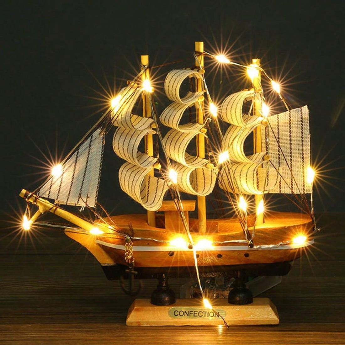 Add a touch of elegance to your home or office with our Smooth Sailing LED Sailboat Decoration. Crafted with a realistic wooden design, it will bring a calming nautical vibe to any space. The LED lights add a warm and welcoming glow, making it the perfect decor piece for relaxation.