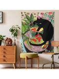 Large cat fishbowl wall tapestry styled over dresser with pink flowers and green leaves