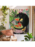 Cat and goldfish botanical tapestry hanging above chair in plant filled room
