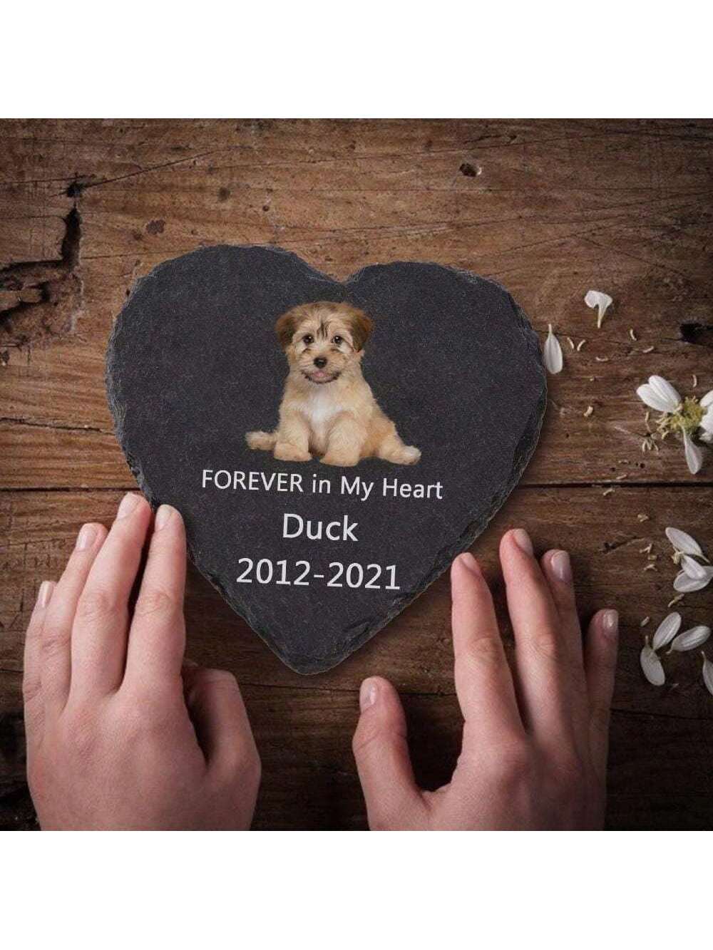 This customized heart-shaped memorial pet stone is a unique and thoughtful gift that allows you to remember and honor your beloved cat, dog, or other animal. Made specifically for you, it features a personalized design that is both beautiful and meaningful. Keep their memory close with this special tribute.