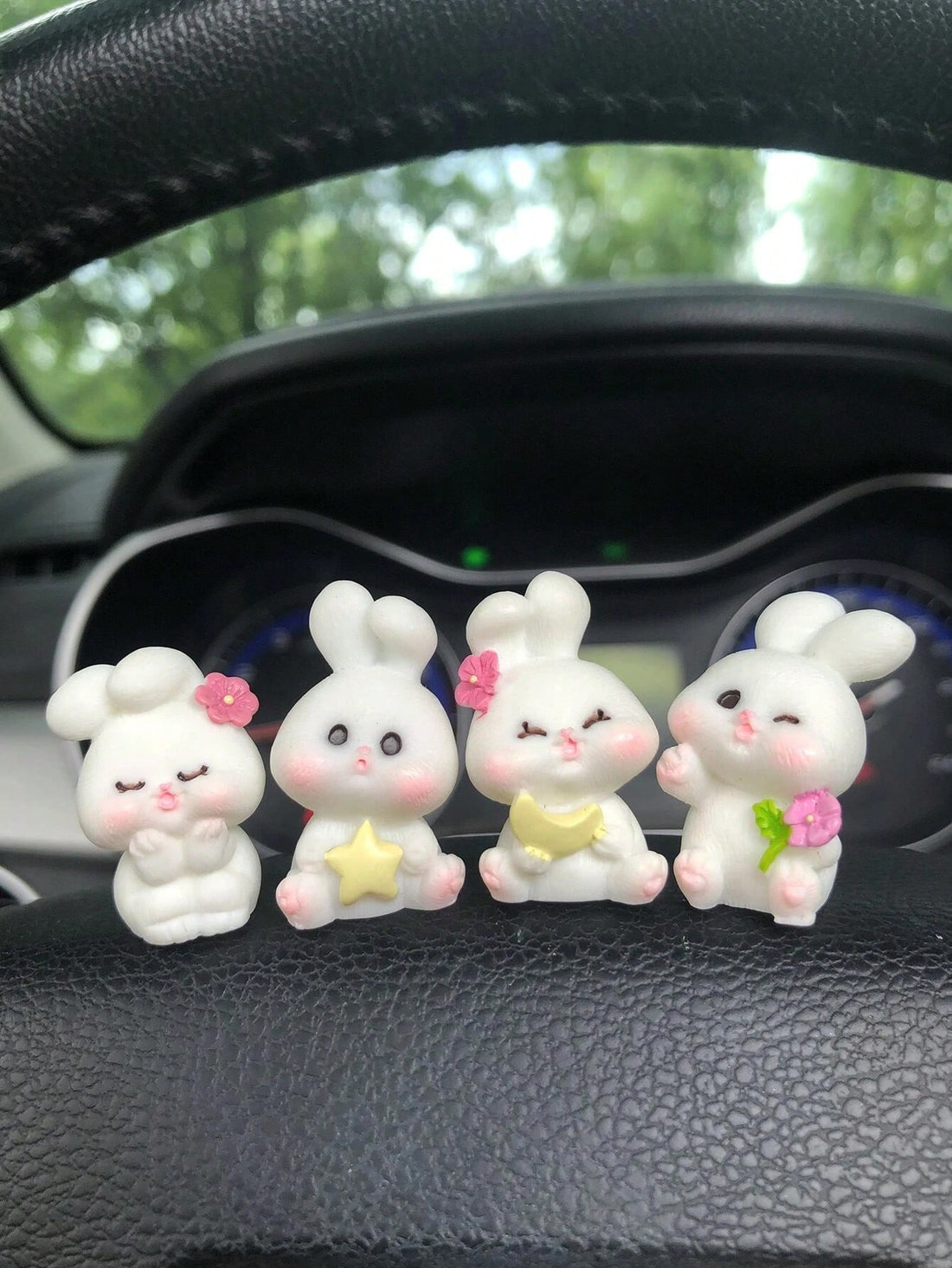 Enjoy a whimsical touch of charm with this 4-piece miniature ornament set featuring adorable rabbit figurines driving in various cars. Each piece is expertly crafted and painted, perfect for adding a touch of whimsy to any desk or garden decor.