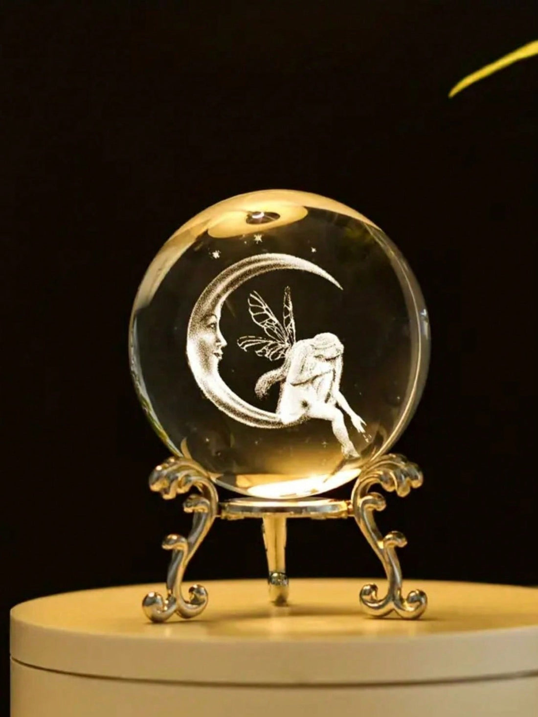 Add a touch of magic to your home with our Moon Fairy Crystal Ball. This stunning glass planet decor is not only a beautiful addition to your table, but also a unique and creative way to bring the enchantment of the moon into your living space. Expertly crafted, this crystal ball is perfect for any fairy or fantasy lover.