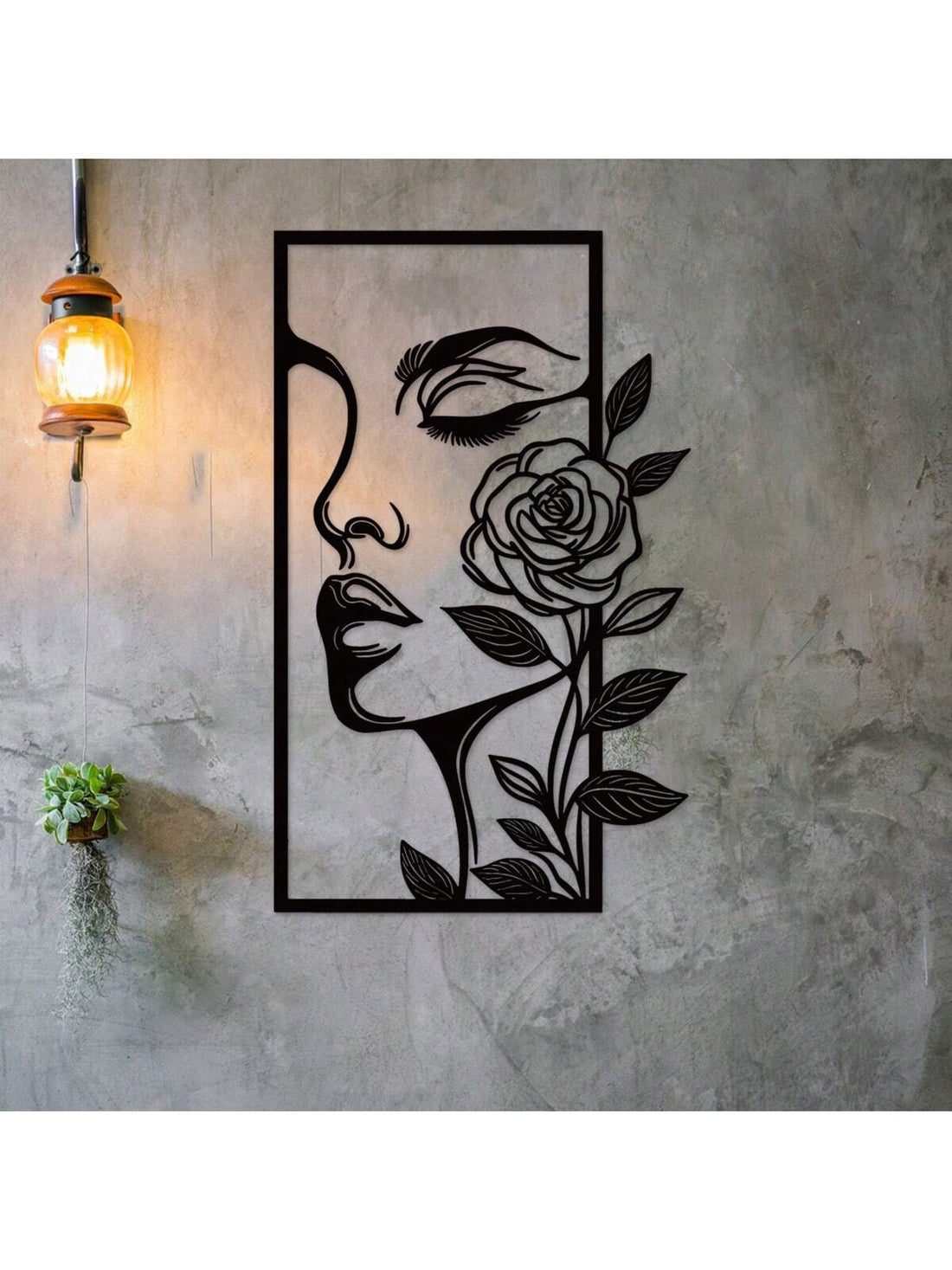 Add a touch of elegance and beauty to your home with Floral Femme Fatale metal wall decor. Featuring a woman's face and delicate flower outline, this ornament exudes an aesthetic charm. Crafted with high-quality metal, it is durable and adds a unique touch to any room.