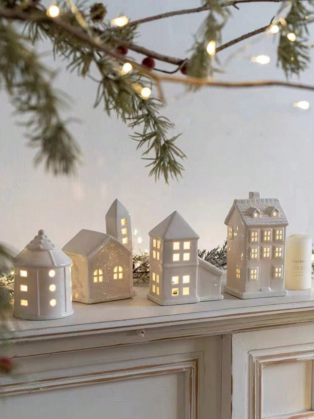 Introduce festive charm into your home with our Charming Ceramic Christmas House Ornament. Made from high-quality ceramic, this ornament adds a cozy atmosphere to your holiday decor. With its intricate details and warm colors, it's the perfect addition to any Christmas display.