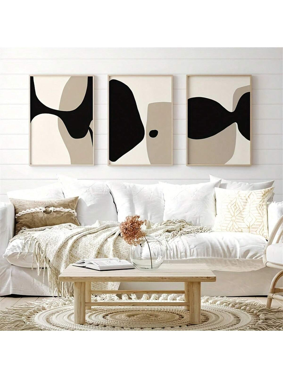 Looking to add a modern touch to your home decor? This 3-piece abstract art print set, inspired by Scandinavian design, features neutral tones on unframed canvas poster prints. Elevate your space with this minimalist and versatile wall decor that is sure to impress.