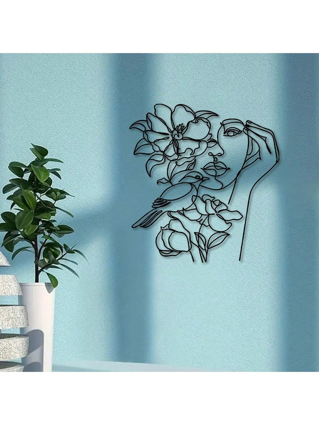 This Modern Abstract Female Single Line Art Metal Wall Decor features a minimalist design that adds a touch of sophistication to any home. Crafted with precision and attention to detail, this piece of wall art adds a modern, artistic touch to your interior. Made from high-quality metal, it is durable and long-lasting. Elevate your space with this eye-catching wall hanging.