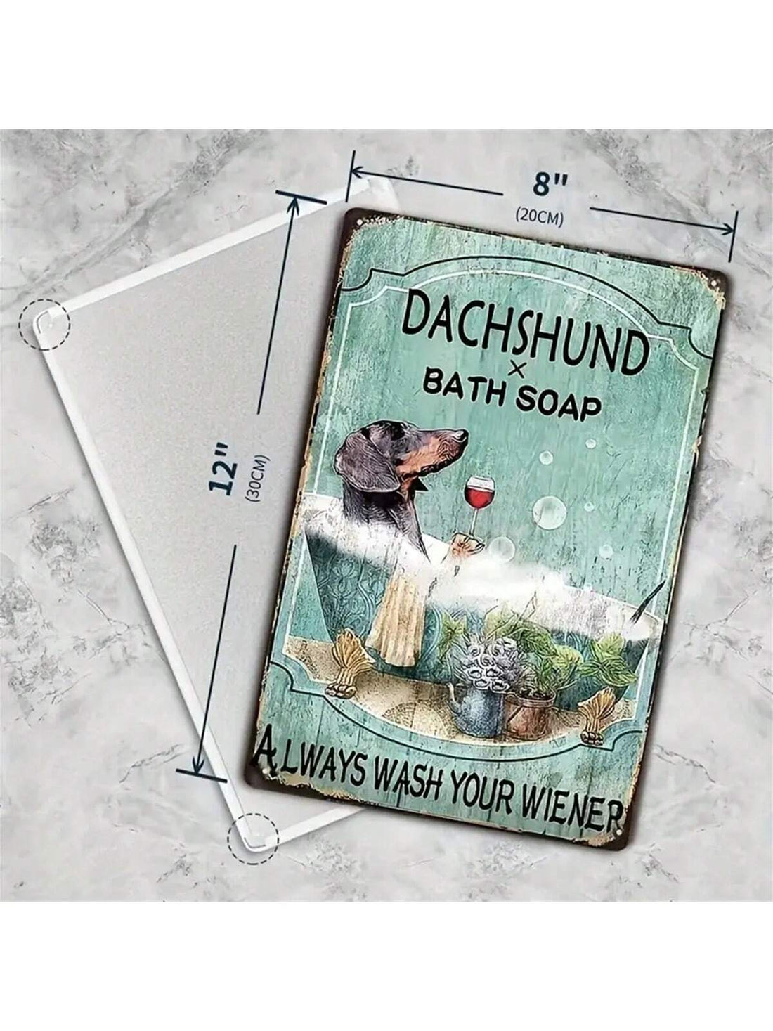 This vintage tin sign adds a touch of humor to any bathroom. Featuring a dachshund and the phrase "Wash Your Weiner Dog with Style!" it's perfect for dog lovers. Made of durable tin, it adds a classic touch to any decor.