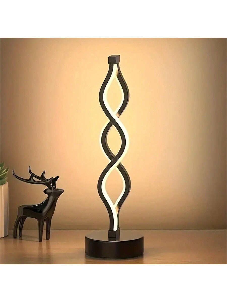 Illuminate your space with the Spiral Table Lamp. Designed for cozy warmth, this lamp is perfect for creating a relaxing atmosphere in KTV rooms, coffee shops, and bedrooms. The unique spiral shape adds a touch of style and ambiance to any space.