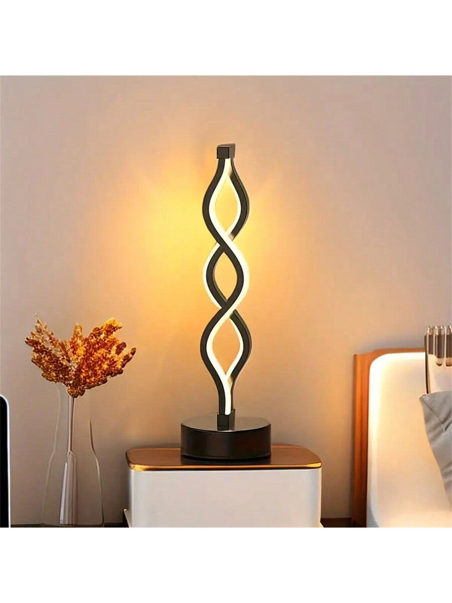 Illuminate your space with the Spiral Table Lamp. Designed for cozy warmth, this lamp is perfect for creating a relaxing atmosphere in KTV rooms, coffee shops, and bedrooms. The unique spiral shape adds a touch of style and ambiance to any space.