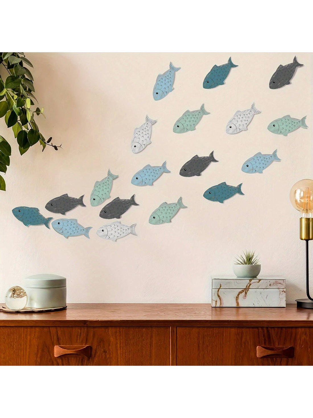 Elevate your outdoor and lake house decor with our Nautical School of Fish Wooden Wall Decor. Bringing a coastal theme to your home, this wall decor adds a touch of nautical charm. Crafted from high-quality wood, it showcases a school of fish swimming in the ocean. Perfect for any water lover.