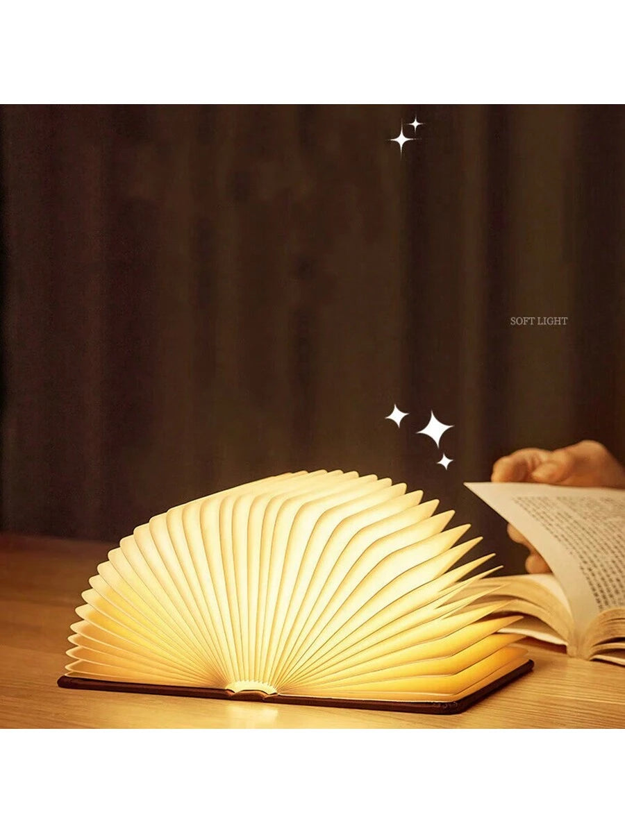 LED wooden book light opened with warm glowing pages
