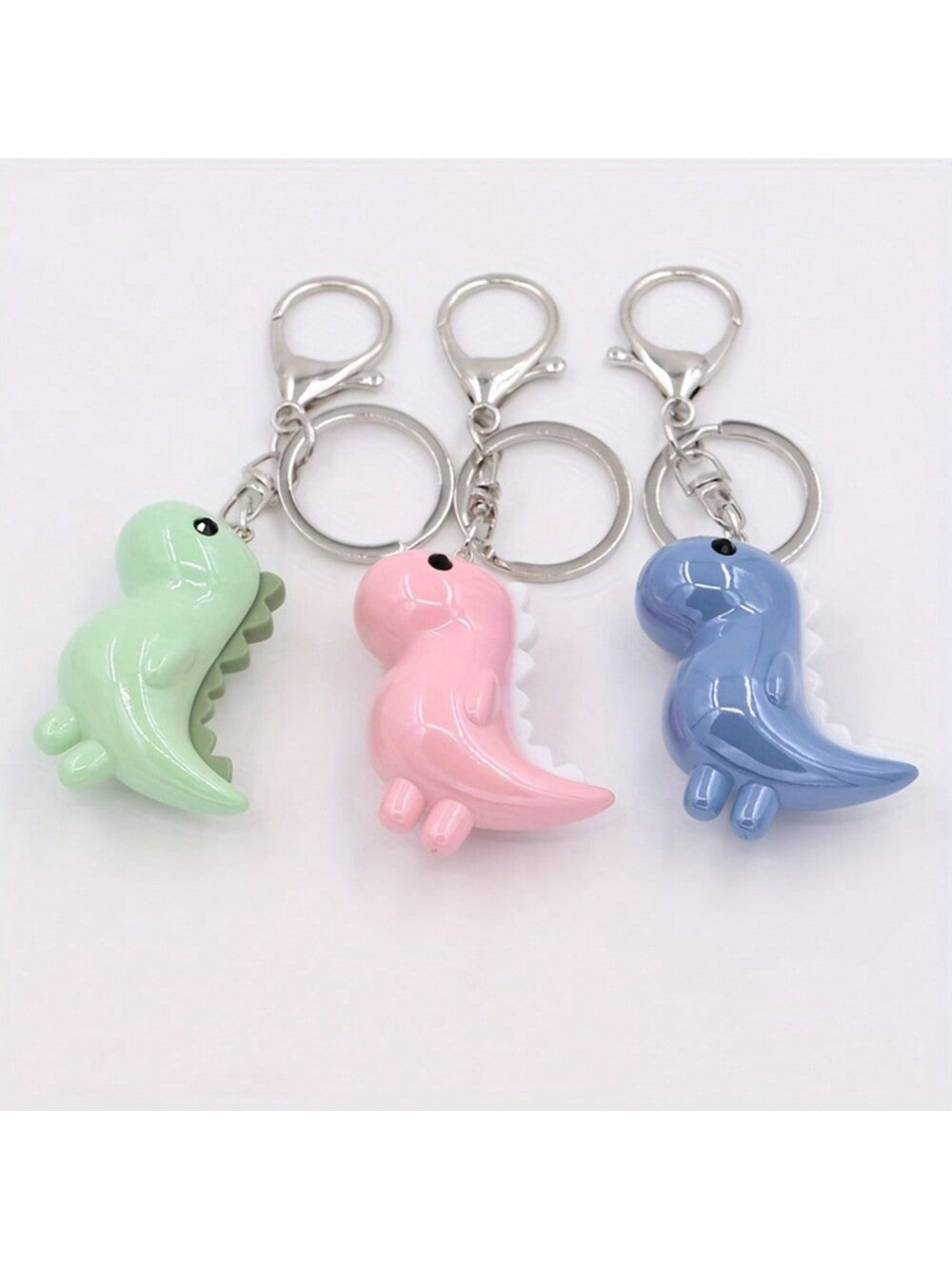 This charming keychain features a cute and colorful Kawaii dinosaur design that is sure to be loved by all ages. Made of durable acrylic, it is the perfect gift for any occasion. Add a touch of adorable charm to your keys or bag with this delightful accessory.