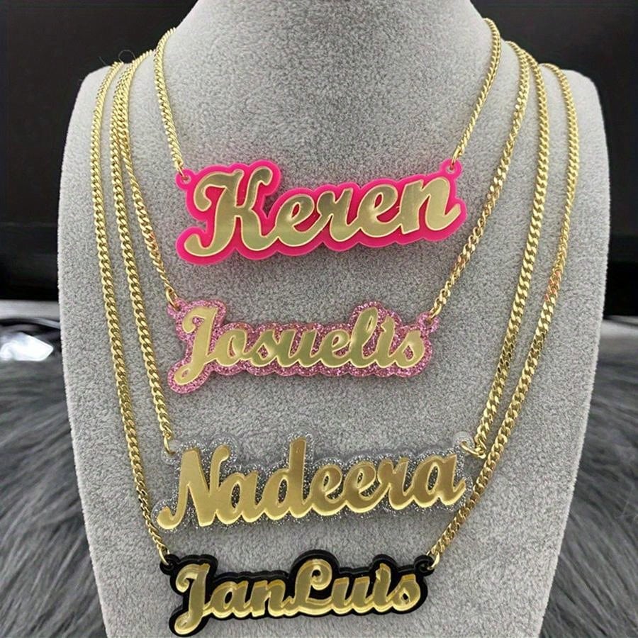 This Personalized Colorful Nameplate Necklace is a unique and thoughtful gift option. Made with high-quality acrylic, this custom necklace features a vibrant nameplate and chain. Make a statement with this one-of-a-kind piece that is sure to bring joy and personalized style to anyone who receives it.