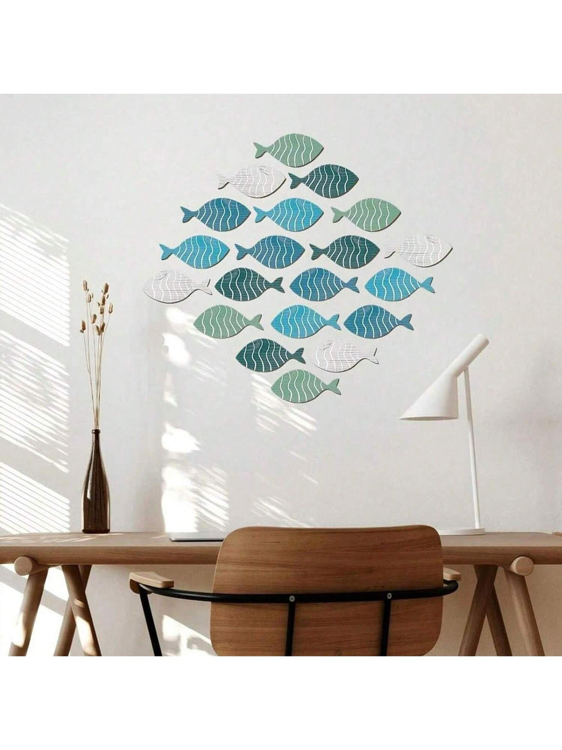 Add a touch of nautical charm to your lake house or beach home with this wooden fish wall decor. Made from high-quality materials, this piece is perfect for adding a coastal vibe to your space. Its intricate details and vibrant colors will make it a standout statement piece.