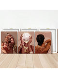 Three canvas panels leaning on floor with rear frames visible