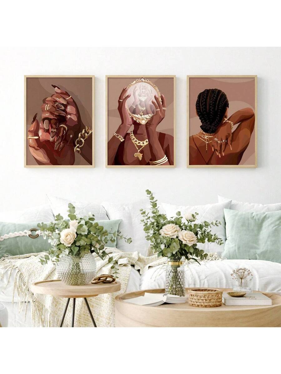 Gold framed 3pc Afrocentric wall art over sofa in bright living room