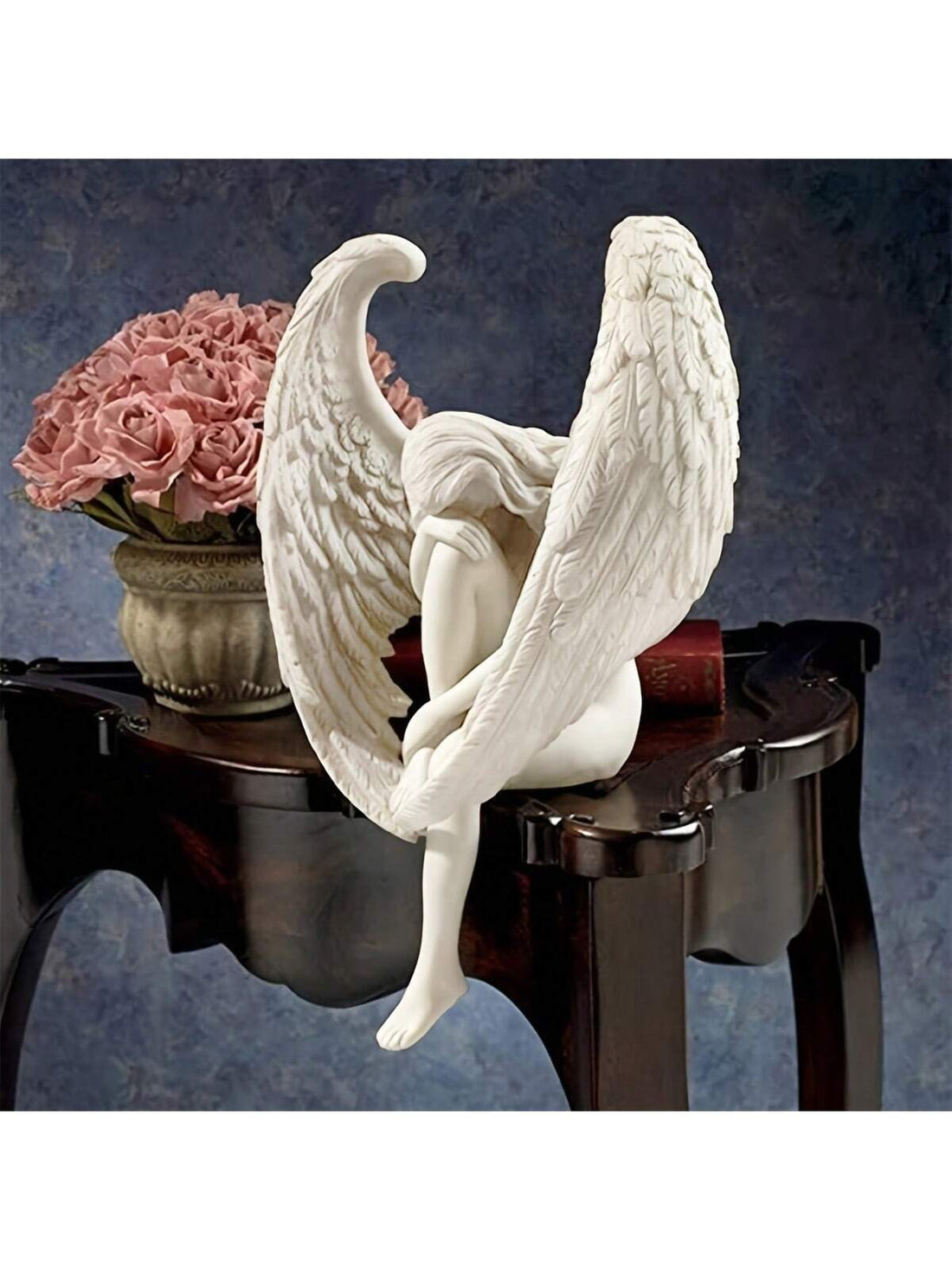 Step into a heavenly realm with our Redemption Angel Wings Statue: A Nordic Wind Stairway to Heaven. This beautifully crafted statue exudes a sense of peace and serenity, serving as a reminder of life's journey towards redemption. Add a touch of Nordic style and spirituality to your home or office space.