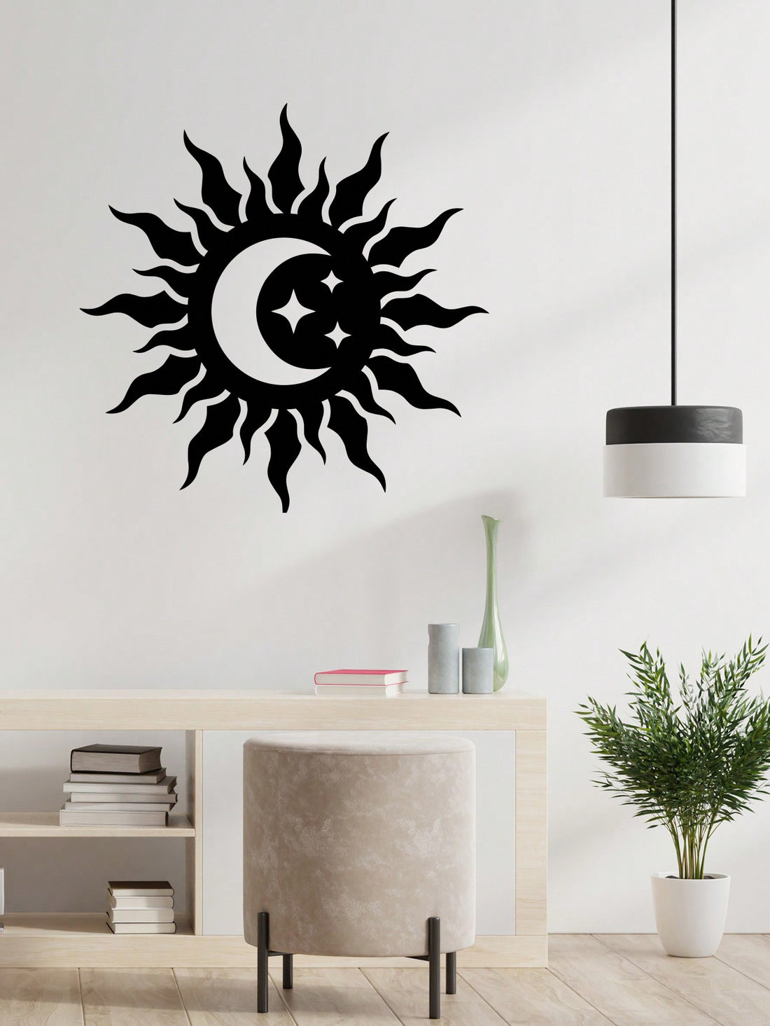 Expertly crafted with metal, this Celestial Harmony wall decoration features a striking round design representing the sun and moon. Its elegant black finish adds a touch of mystery and harmony to any room. Hang it up to bring balance and celestial energy into your space.