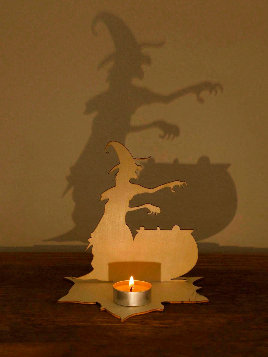 Add a touch of creepiness to your Halloween decor with our Spooky Spirit Wooden Candlestick. Its unique design and dark finish will create an eerie ambiance. Made of high-quality wood, it's perfect for any haunted household. Elevate the spooky factor of your home with this one-of-a-kind decoration.