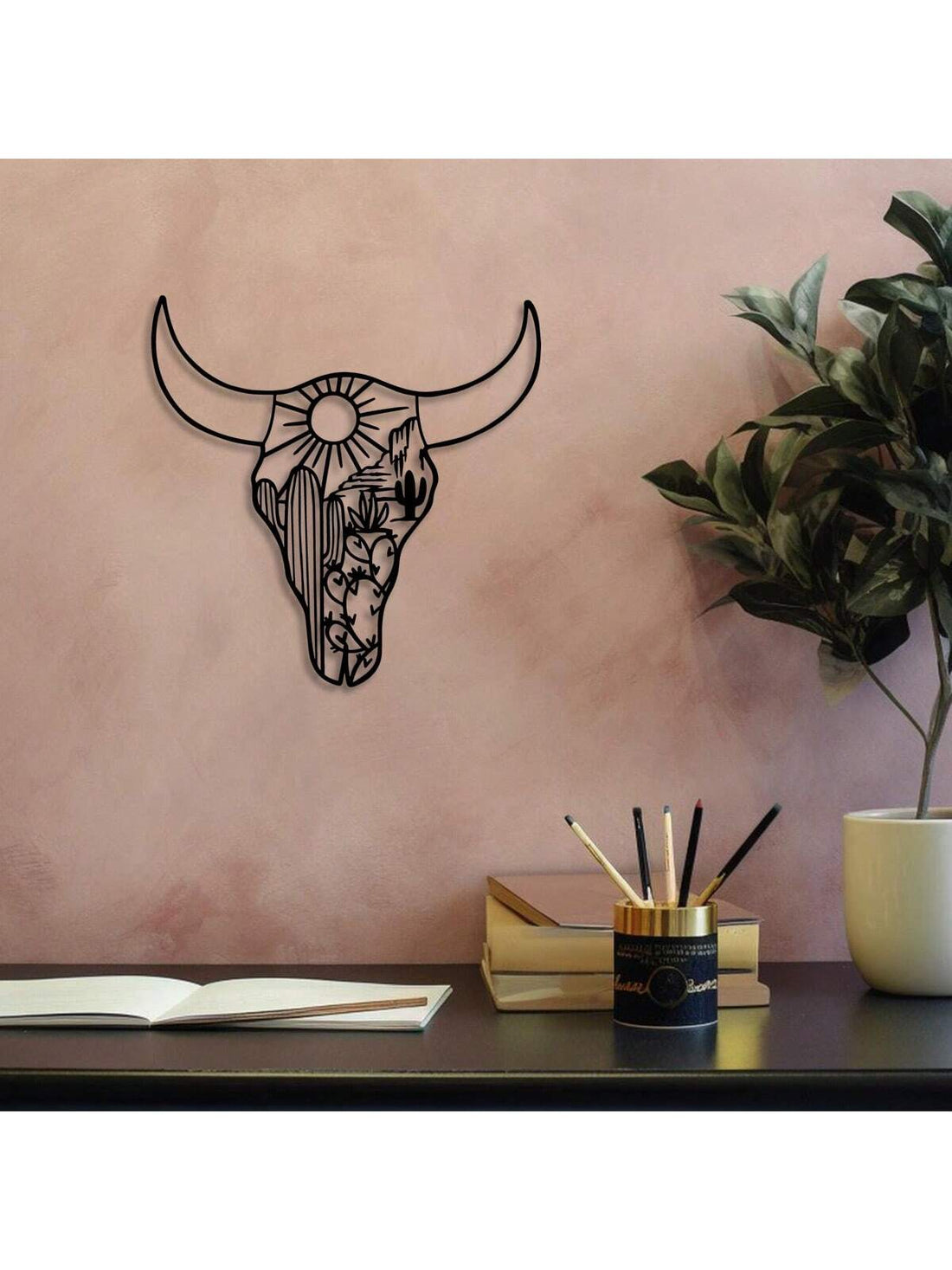 Enhance your home decor with this unique Bohemian Desert Bull Skull Metal Wall Art. Made of durable metal, this Southwestern-inspired piece adds a touch of edginess to any room. Perfect as a Christmas gift for those who appreciate one-of-a-kind, handcrafted decor.