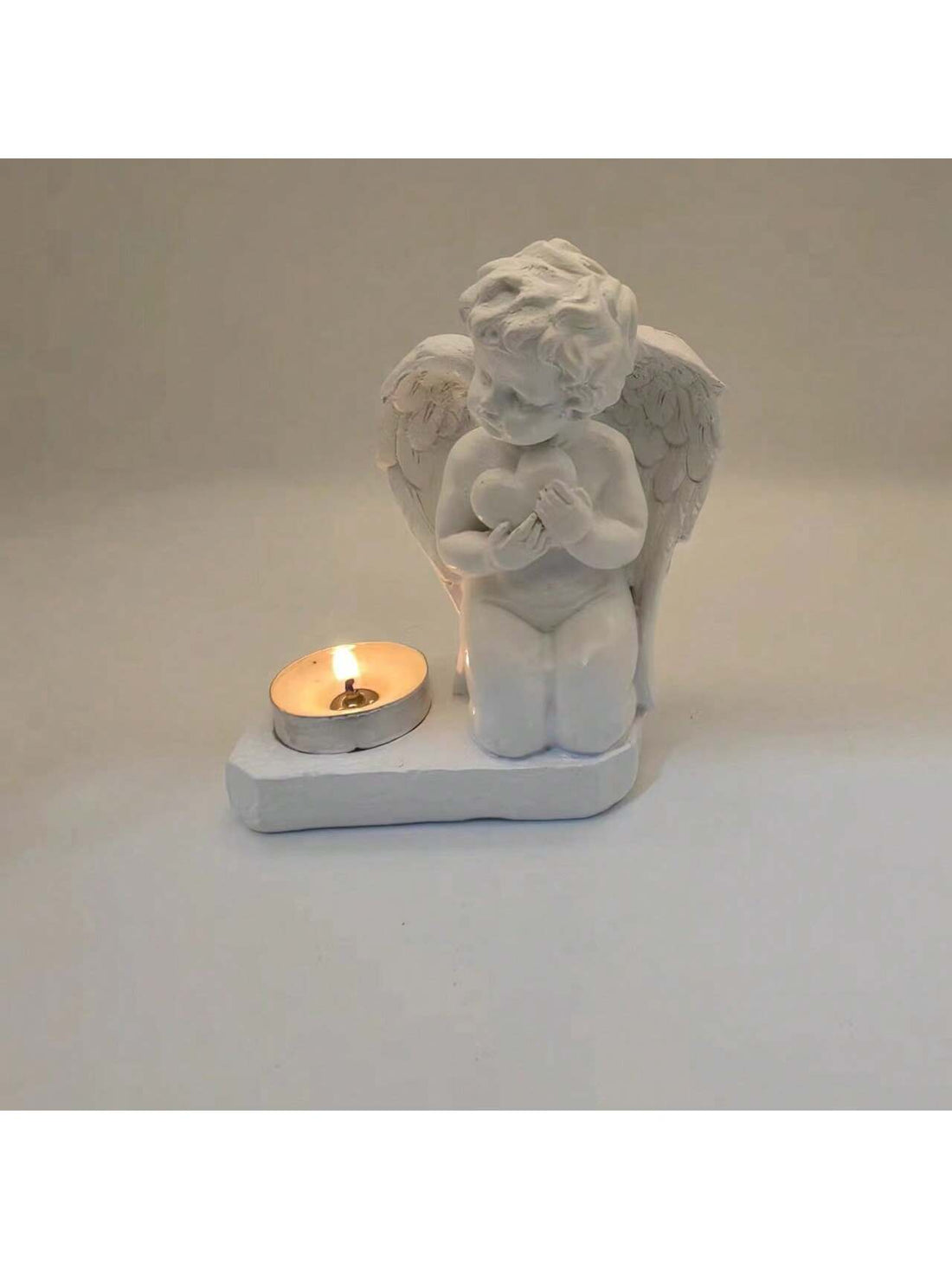 Enhance the ambiance of your home with the Heavenly Love Candle Holder. This stylish addition adds a romantic touch to any space. Crafted with high-quality materials, it provides a warm and inviting glow. Perfect for creating a cozy atmosphere during dinners, date nights or quiet evenings at home.