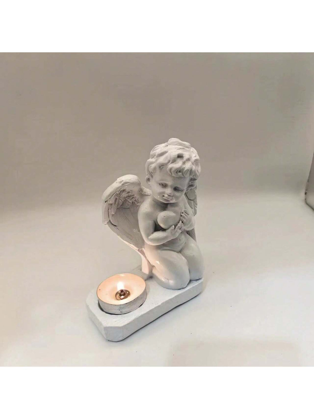 Enhance the ambiance of your home with the Heavenly Love Candle Holder. This stylish addition adds a romantic touch to any space. Crafted with high-quality materials, it provides a warm and inviting glow. Perfect for creating a cozy atmosphere during dinners, date nights or quiet evenings at home.