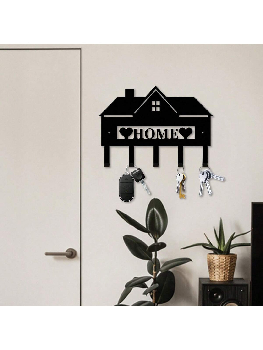 Keep your keys organized and easily accessible with our Home Key Organizer. Wall mounted and made from sturdy metal, this decor hanger not only provides a convenient storage solution, but also adds a touch of style to your home. No more searching for lost keys - keep them neat and tidy with our organizer.